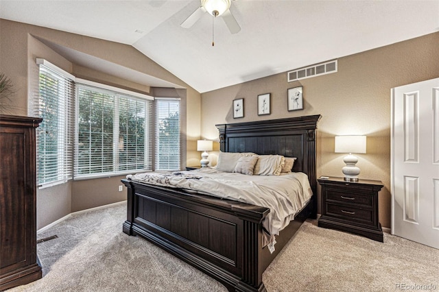 bedroom featuring lofted ceiling, ceiling fan, and light colored carpet