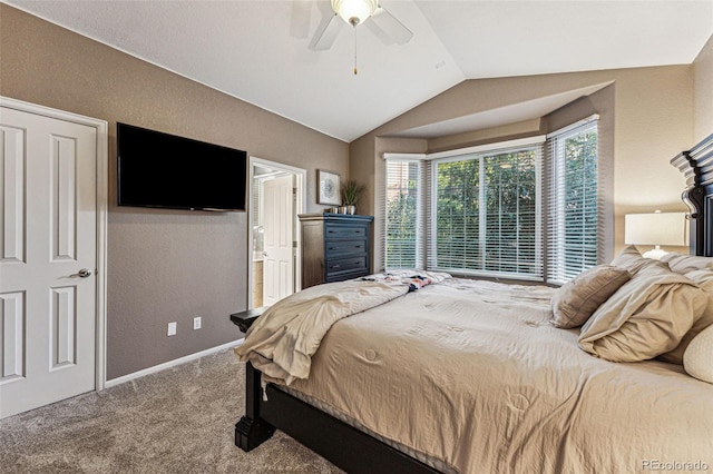 bedroom with ceiling fan, lofted ceiling, and carpet