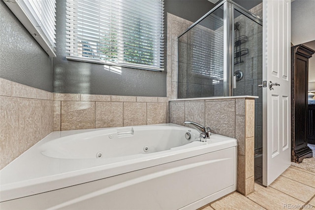 bathroom featuring separate shower and tub and tile patterned flooring