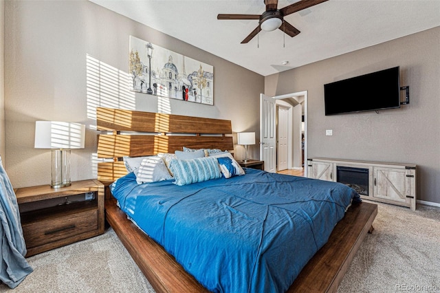 carpeted bedroom with ceiling fan