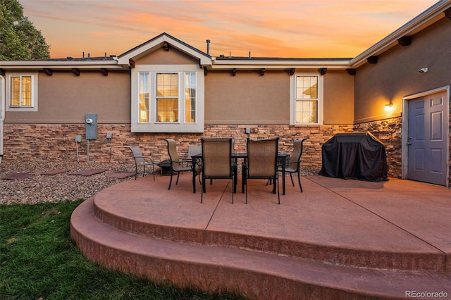 patio terrace at dusk with grilling area