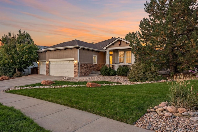 view of front of house with a lawn and a garage