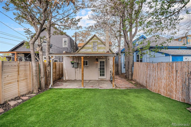 back of property with a patio area and stucco siding