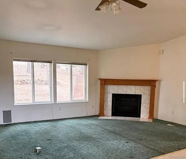 3647 Pathfinder Rd Unit B, Florissant, CO 80816 - unfurnished living room with carpet, a ceiling fan, and a tile fireplace