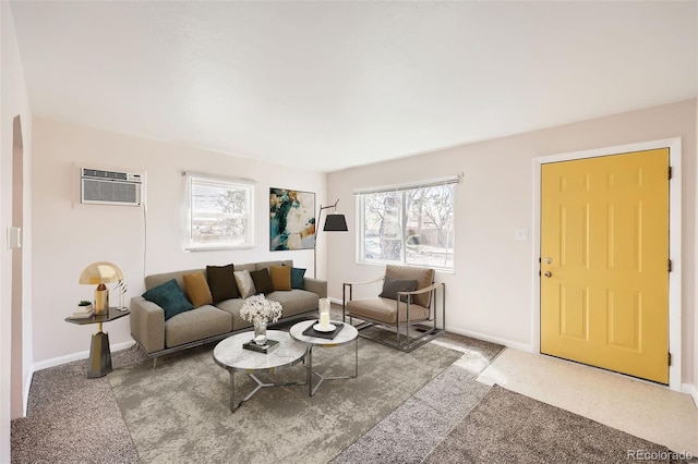 living area with baseboards, a wall mounted AC, and carpet flooring