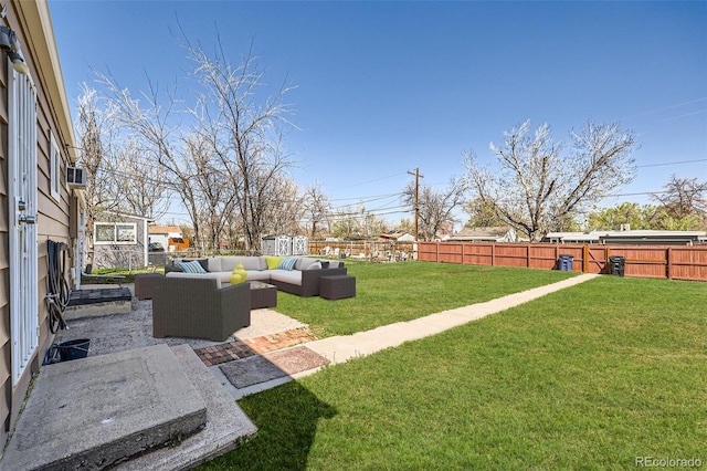 view of yard featuring a fenced backyard, outdoor lounge area, and a patio area