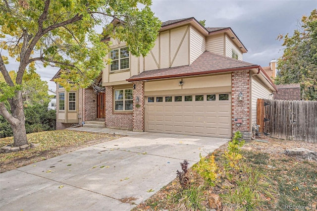 tudor home featuring a garage