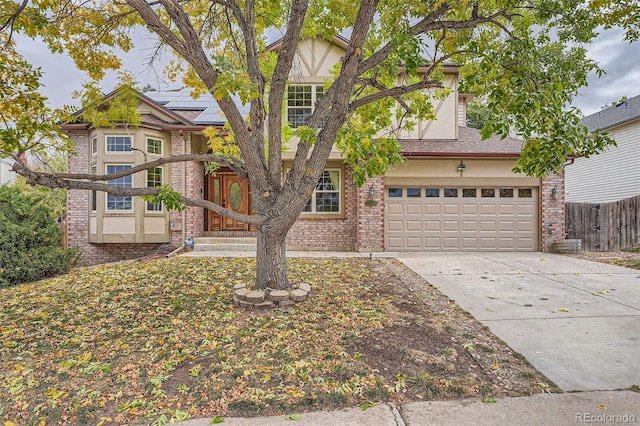 view of front of home with a garage and solar panels