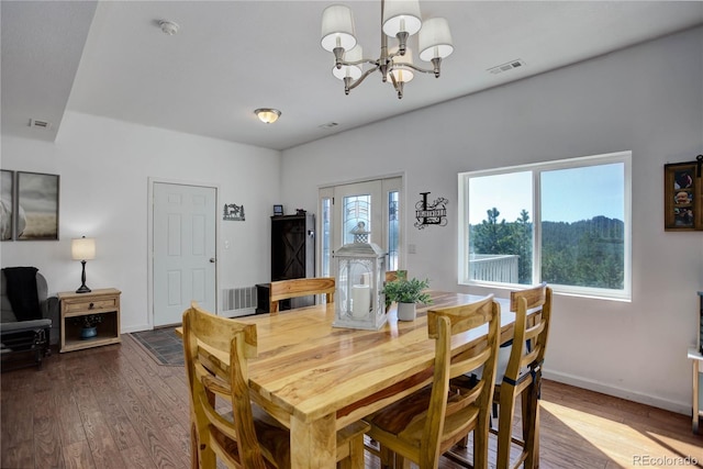 777 Deerview Dr, Florissant, CO 80816 - dining room with a chandelier, wood finished floors, and baseboards