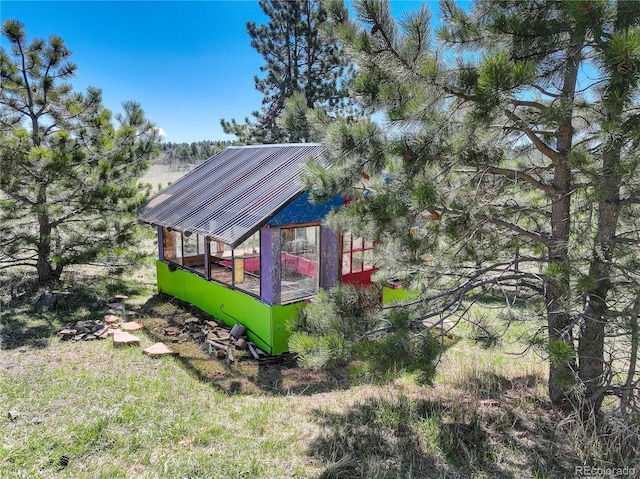 777 Deerview Dr, Florissant, CO 80816 - view of side of property featuring an outbuilding and a greenhouse