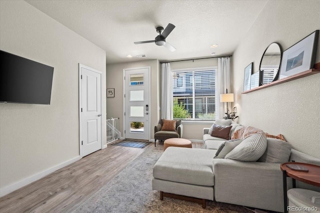 19592 W 93rd Pl Unit C, Arvada, CO 80007 - living area featuring wood finished floors, a textured wall, ceiling fan, and a textured ceiling