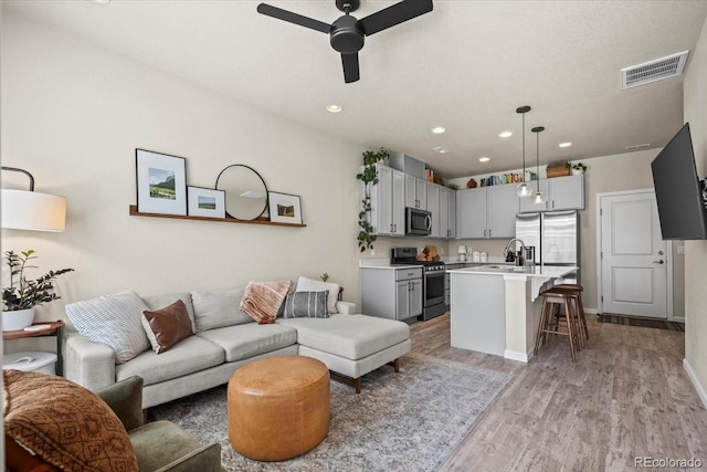 19592 W 93rd Pl Unit C, Arvada, CO 80007 - living area with ceiling fan, light wood-type flooring, and recessed lighting