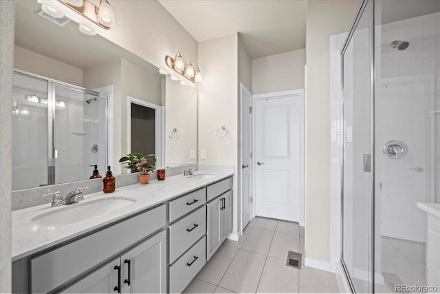 19592 W 93rd Pl Unit C, Arvada, CO 80007 - bathroom featuring double vanity, tile patterned flooring, and a stall shower