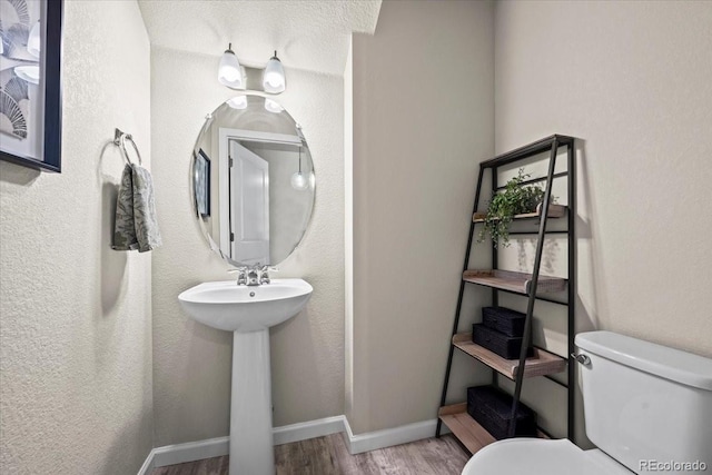 19592 W 93rd Pl Unit C, Arvada, CO 80007 - bathroom featuring wood finished floors and toilet