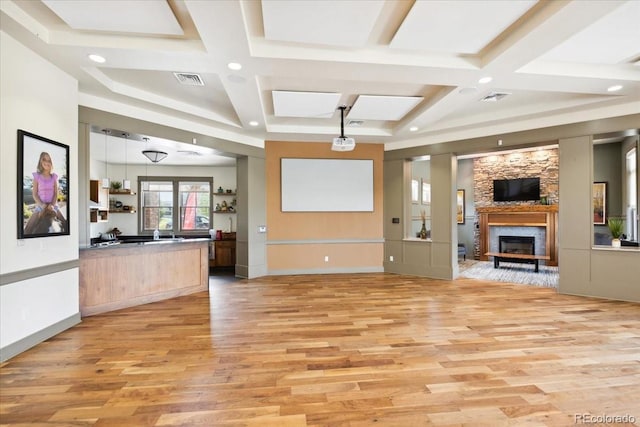 19592 W 93rd Pl Unit C, Arvada, CO 80007 - unfurnished living room featuring coffered ceiling, light wood-style floors, a fireplace, beamed ceiling, and recessed lighting