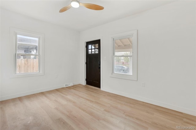 entryway featuring light hardwood / wood-style floors, a healthy amount of sunlight, and ceiling fan