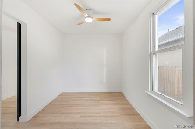 spare room with light hardwood / wood-style floors and ceiling fan