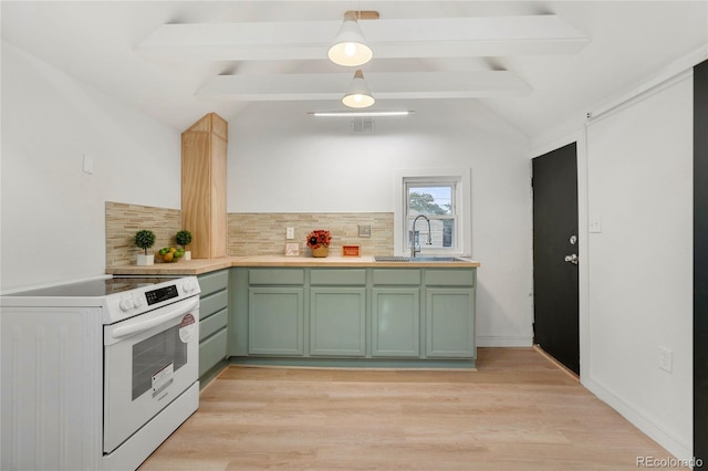 kitchen with sink, green cabinets, electric range, decorative backsplash, and light hardwood / wood-style flooring