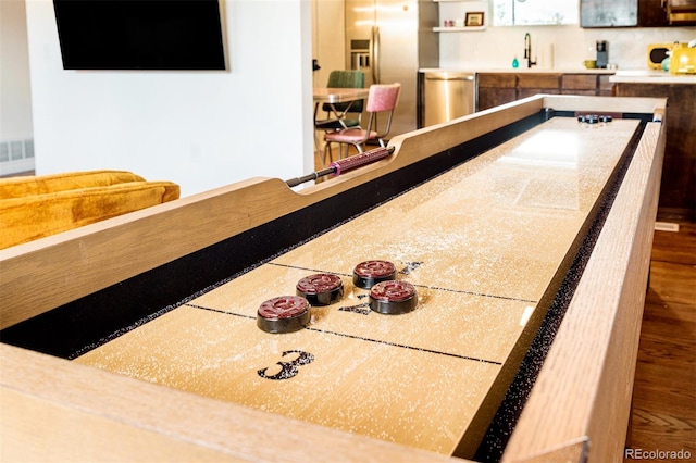 rec room with a sink and wet bar