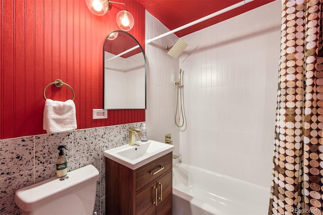 bathroom with toilet, vanity, and shower / bathtub combination with curtain