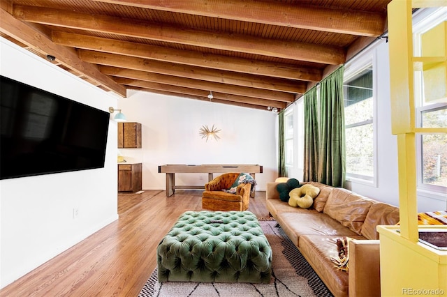 living room featuring beamed ceiling, wood ceiling, light wood-type flooring, and baseboards