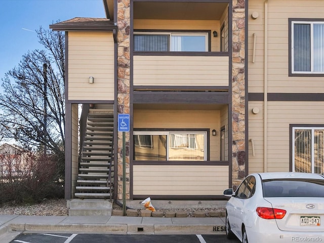 multi unit property with stairway and uncovered parking