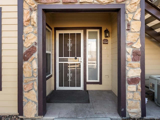 view of exterior entry with stone siding