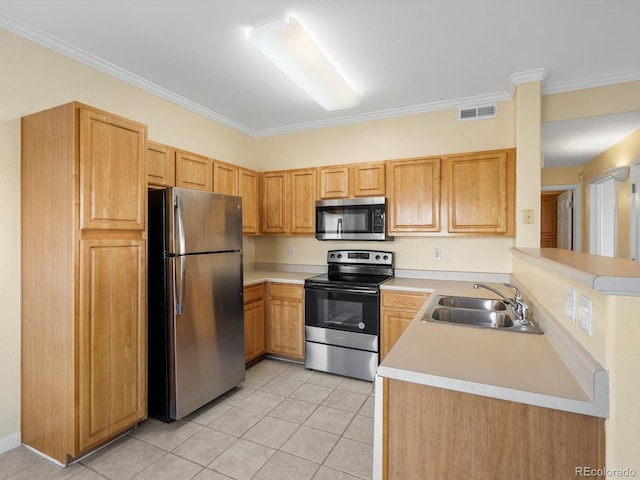 kitchen with a sink, visible vents, appliances with stainless steel finishes, and light countertops