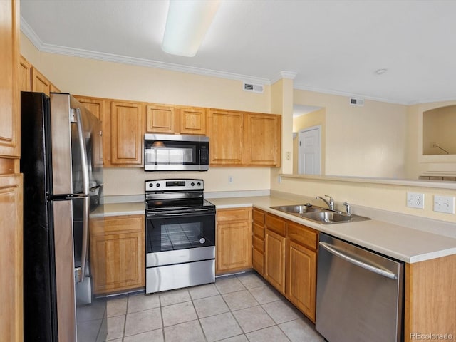 kitchen with a sink, light tile patterned flooring, visible vents, and stainless steel appliances