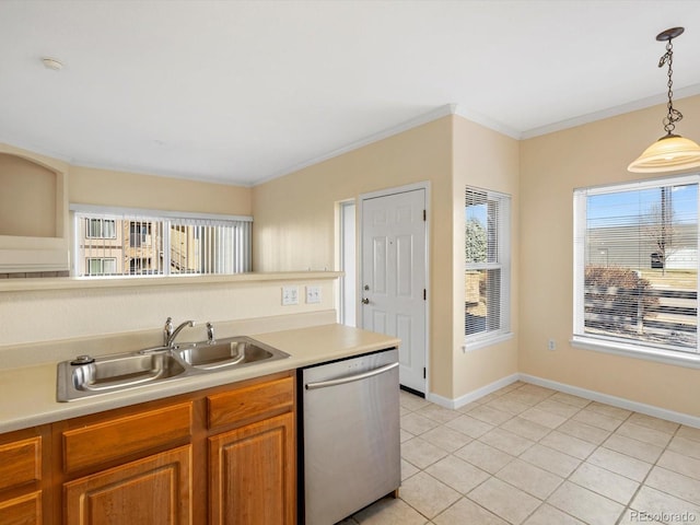 kitchen with dishwasher, light countertops, crown molding, and a sink