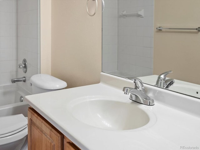 full bath featuring tub / shower combination, toilet, and vanity