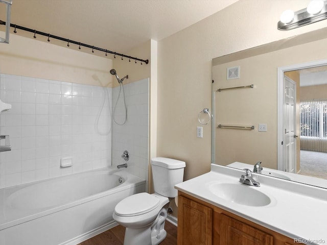 full bath featuring visible vents, toilet, wood finished floors, shower / washtub combination, and vanity