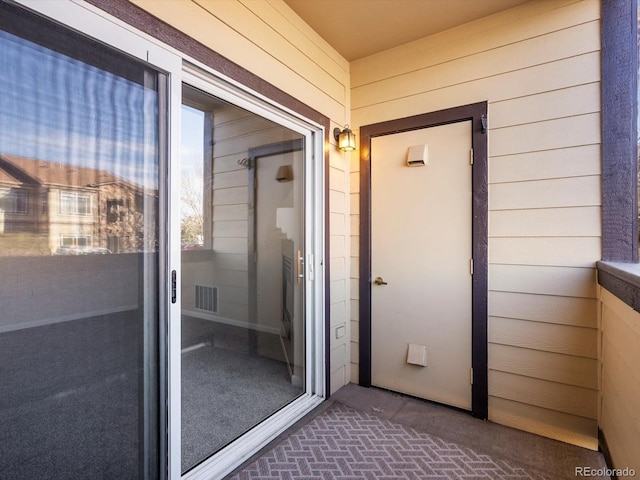 doorway to property with visible vents