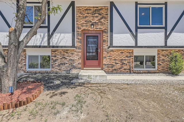 17979 E Oxford Pl, Aurora, CO 80013 - view of exterior entry featuring brick siding and stucco siding