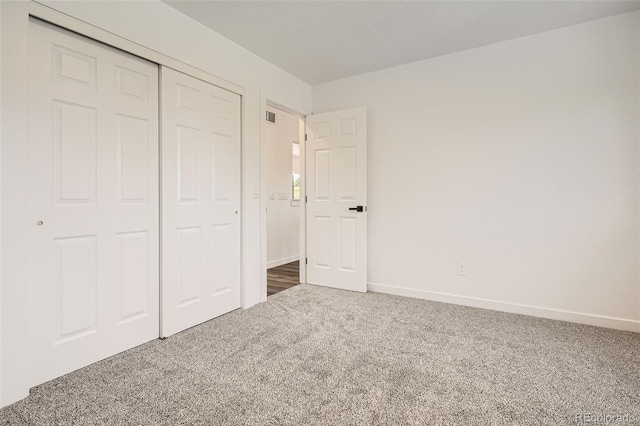 17979 E Oxford Pl, Aurora, CO 80013 - unfurnished bedroom with carpet flooring, a closet, and baseboards