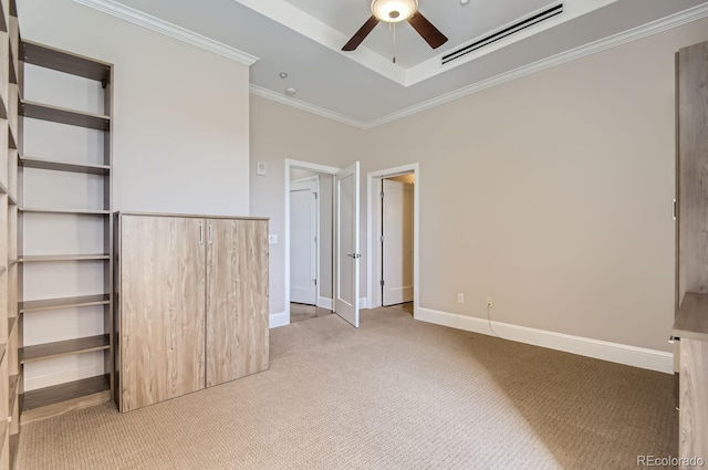 unfurnished bedroom with crown molding, a wall unit AC, ceiling fan, and light colored carpet