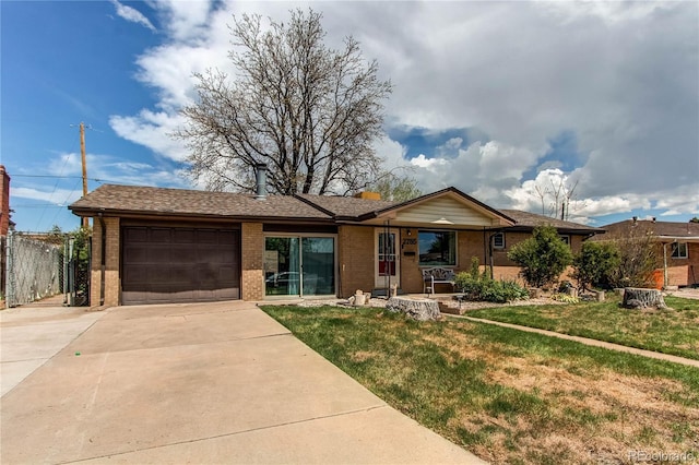 2785 Skyline Dr, Westminster, CO 80030 - ranch-style house with a garage, brick siding, concrete driveway, and covered porch