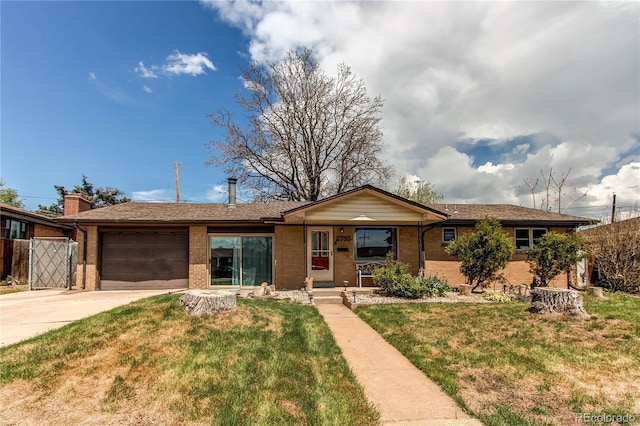 2785 Skyline Dr, Westminster, CO 80030 - single story home with an attached garage, brick siding, concrete driveway, a front lawn, and a porch