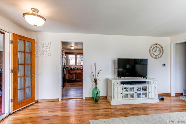 2785 Skyline Dr, Westminster, CO 80030 - living area featuring light wood-type flooring and baseboards