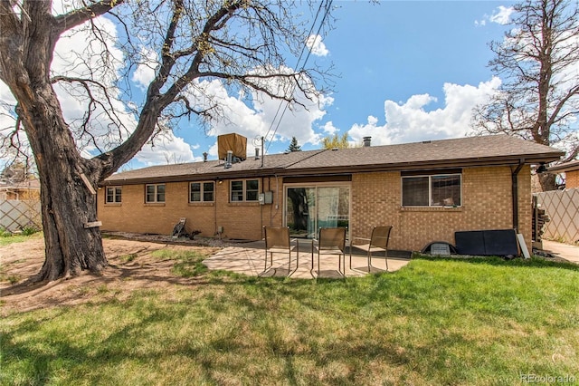 2785 Skyline Dr, Westminster, CO 80030 - back of house featuring brick siding and a patio