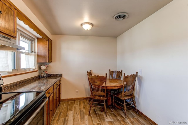 2785 Skyline Dr, Westminster, CO 80030 - dining area with wood tiled floors and baseboards