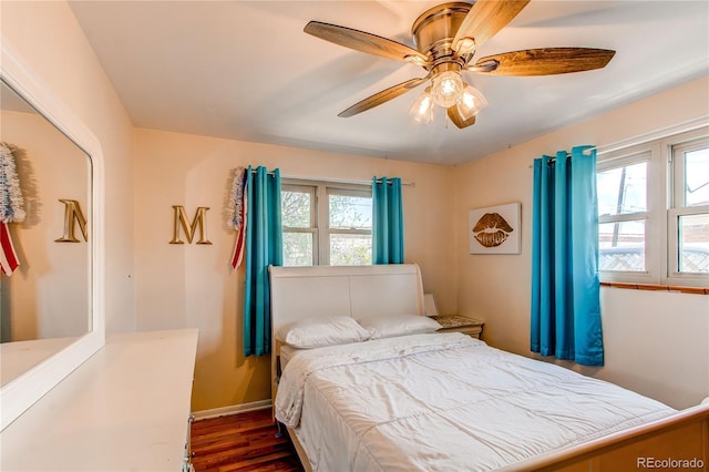2785 Skyline Dr, Westminster, CO 80030 - bedroom featuring multiple windows, dark wood-type flooring, ceiling fan, and baseboards