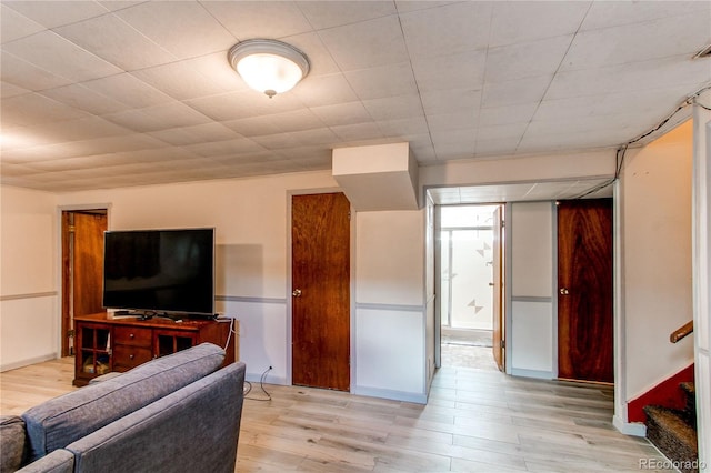 2785 Skyline Dr, Westminster, CO 80030 - living room with wood finished floors, baseboards, and stairway