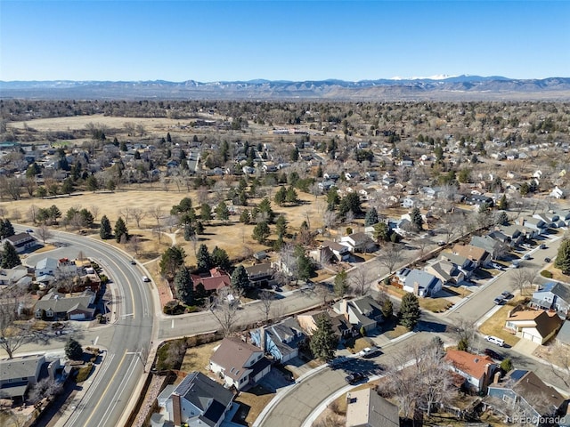 birds eye view of property with a mountain view and a residential view