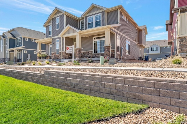 view of front of home featuring a front lawn and a porch