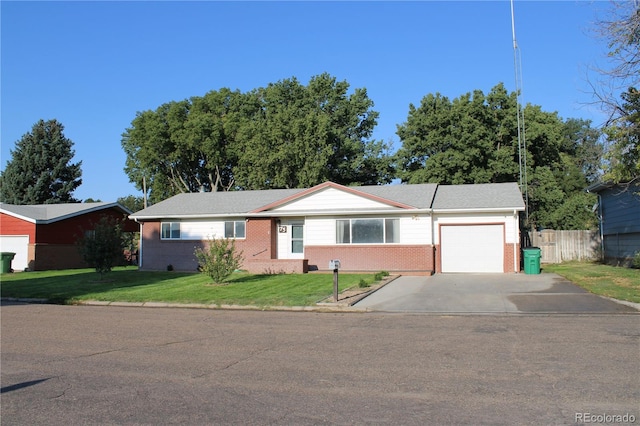 single story home featuring a garage and a front lawn