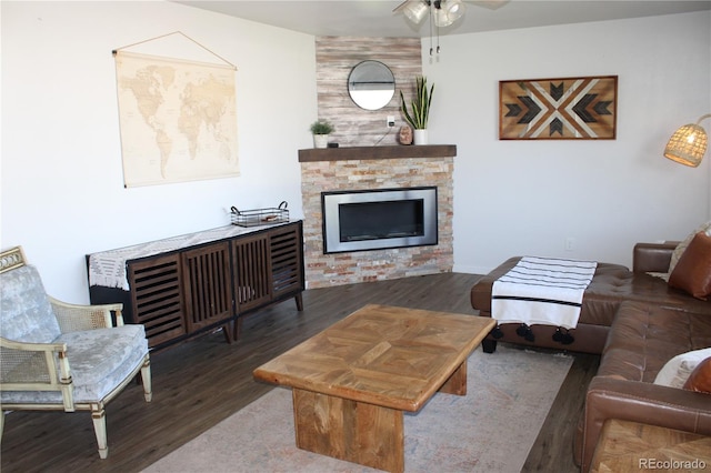 living room with wood-type flooring and ceiling fan