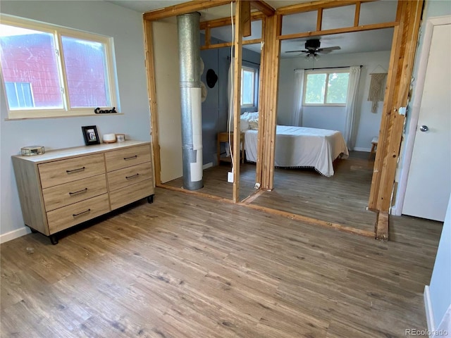 bedroom with hardwood / wood-style floors