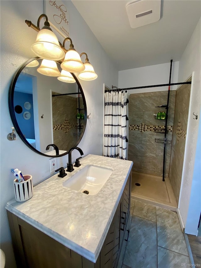 bathroom featuring curtained shower and vanity