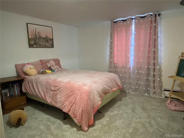 carpeted bedroom with a baseboard radiator